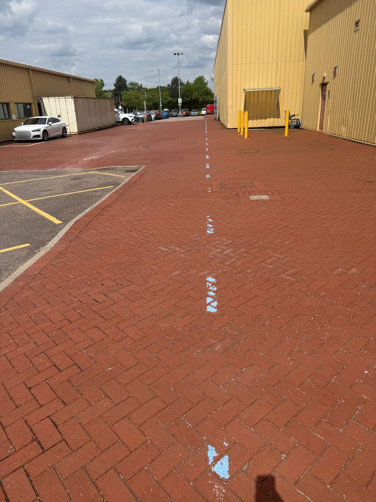 Completed red block paving service road between industrial units