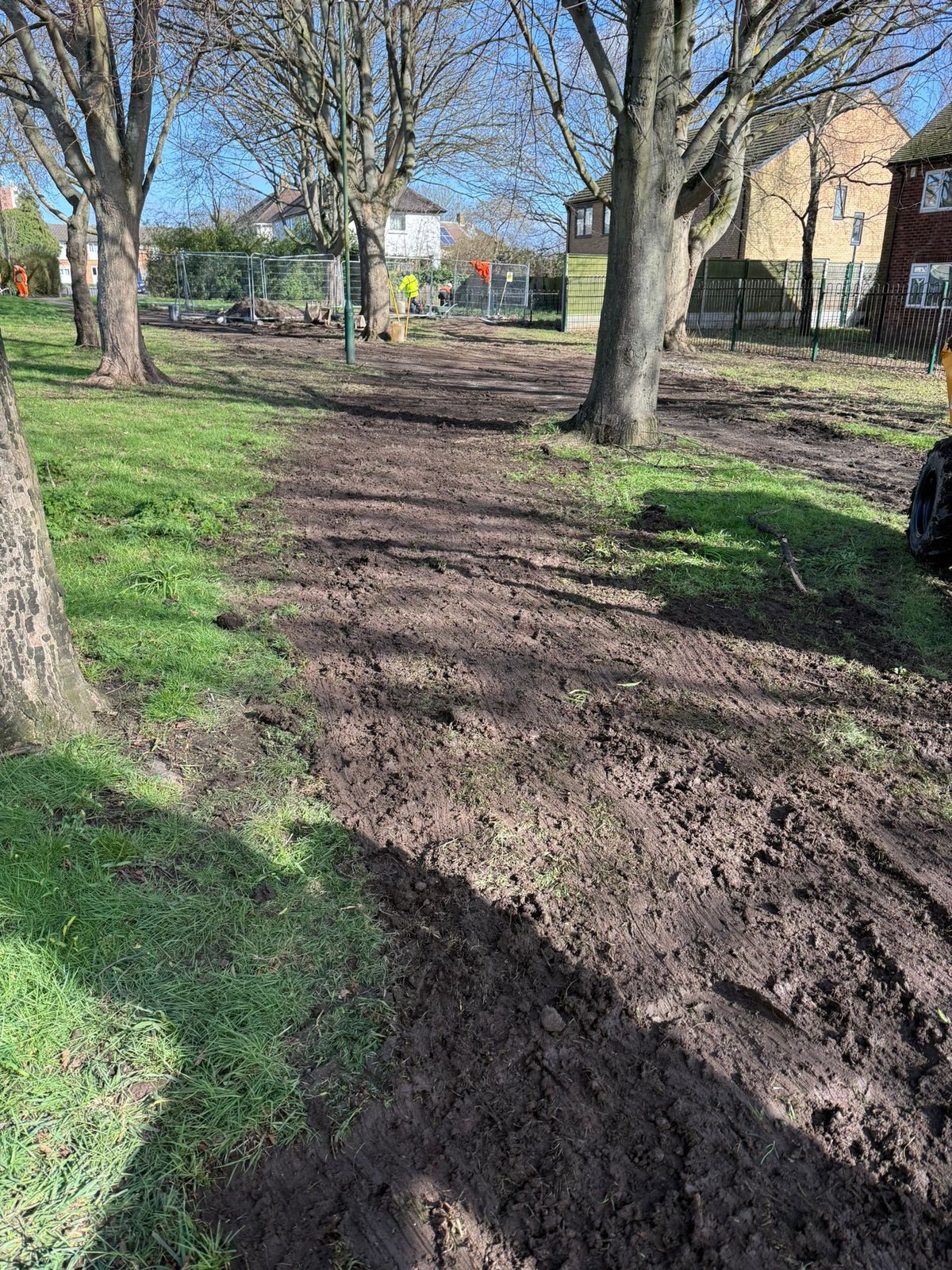 New footpath route excavated through a park, ready for sub-base and edgings