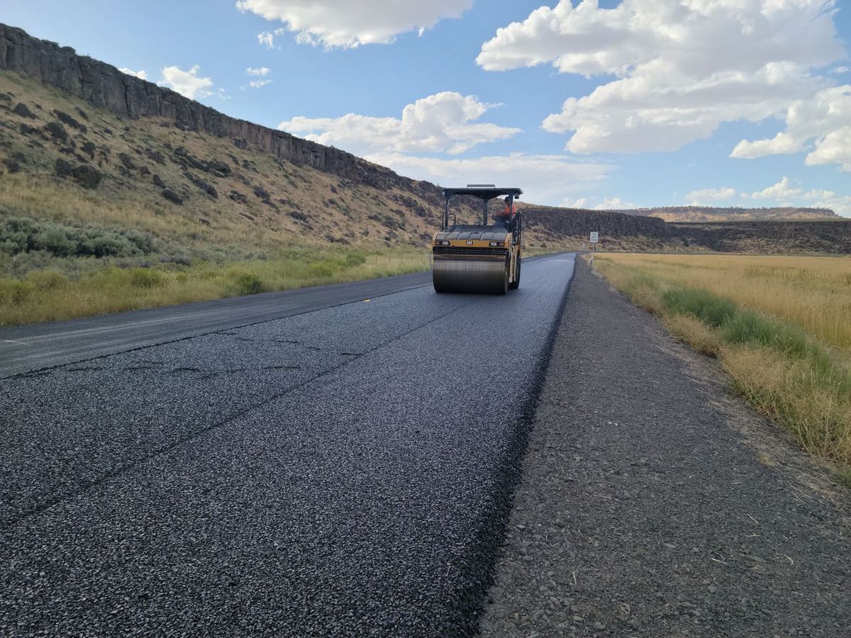 Roller compacting tarmac (illustrative stock photo)