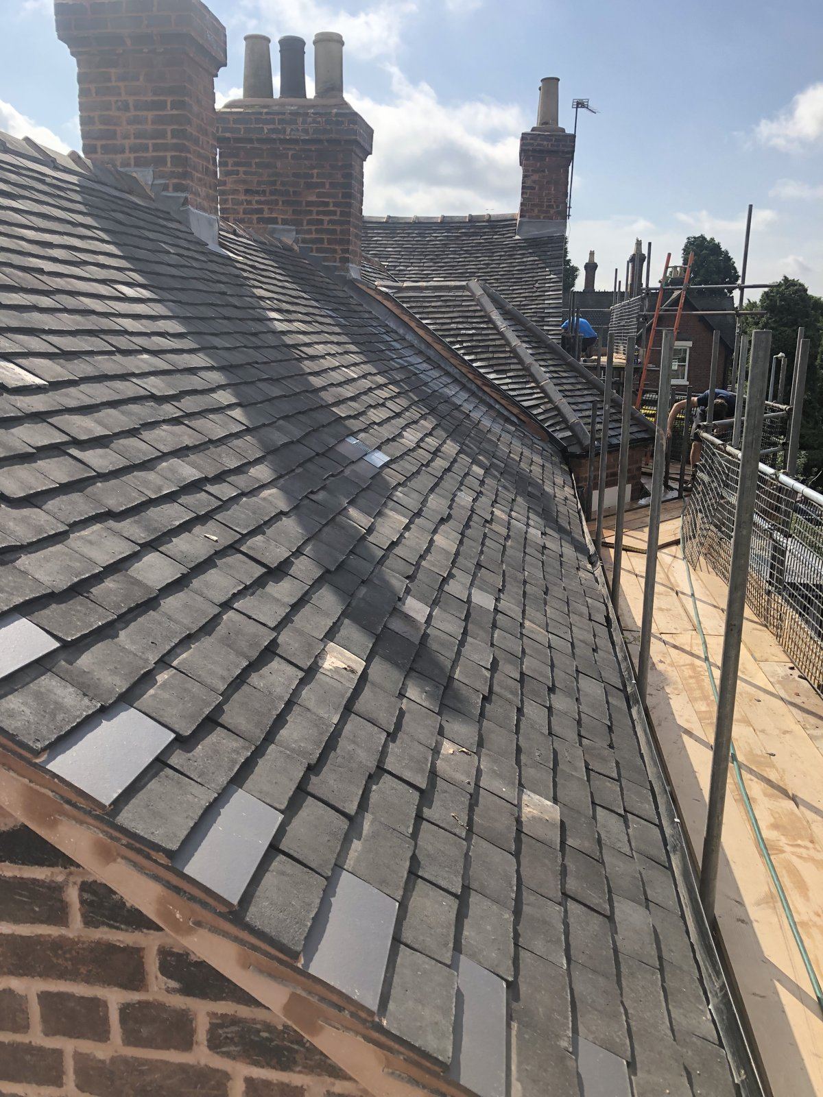 Re-roofed terrace in clay tiles with scaffold access