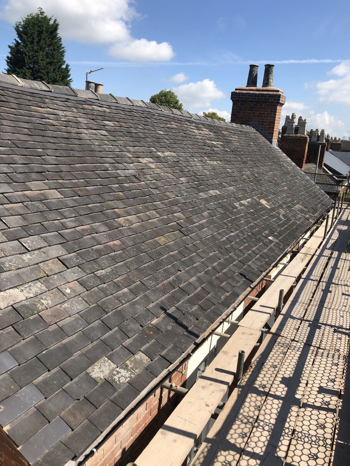 Re-roofed terrace in clay tiles with scaffold access
