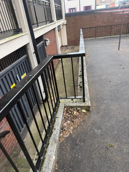 Resurfaced ramp and walkway to a residential block