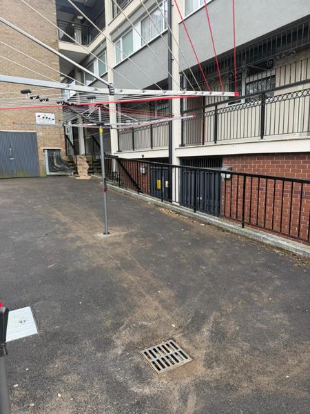 Resurfaced courtyard with new drainage gully
