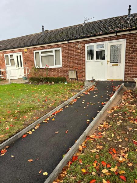 New tarmac path with edging to a bungalow frontage