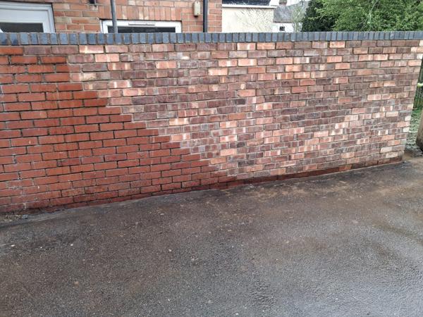 Rebuilt brick boundary wall