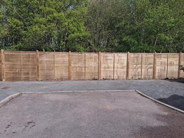 Close-board fencing to a car park boundary