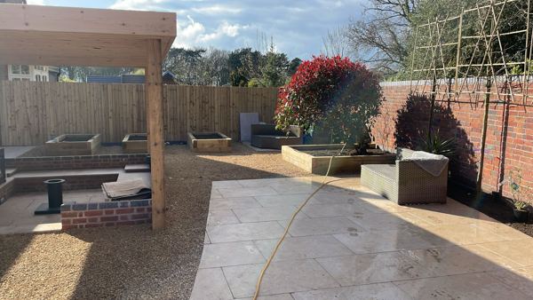 Lichfield garden transformation: sandstone paving, sleeper beds, gravel and hardwood pergola – Staff4dshire Properties