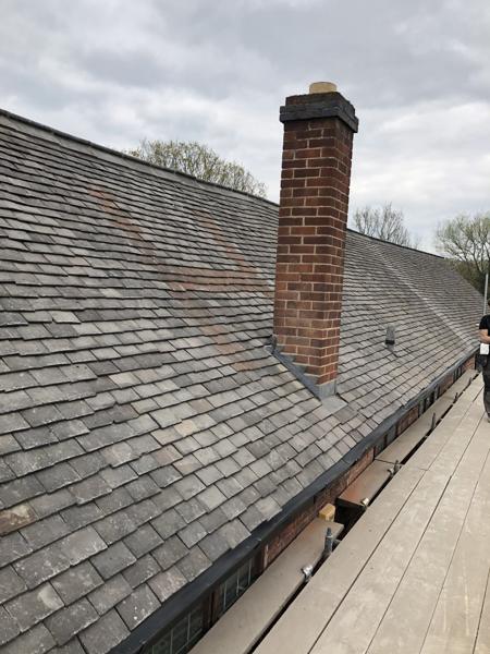 Re-roofed slope with chimney