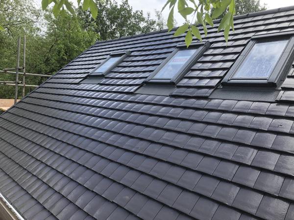 New tiled roof with roof windows and verges