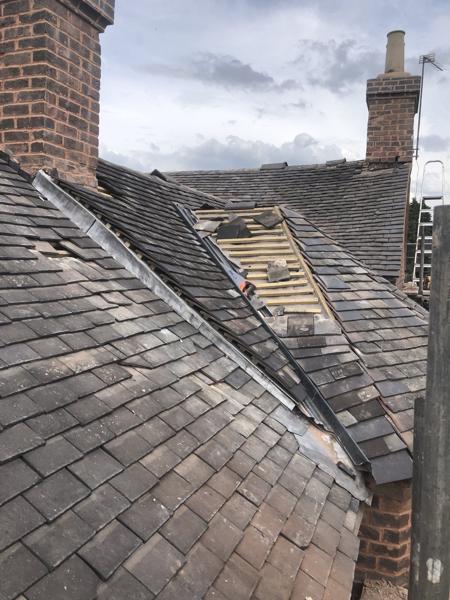 Re-roof with lead valleys and chimney flashings