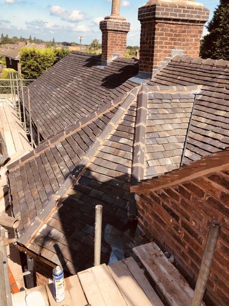 Re-roofed terrace in clay tiles with scaffold access