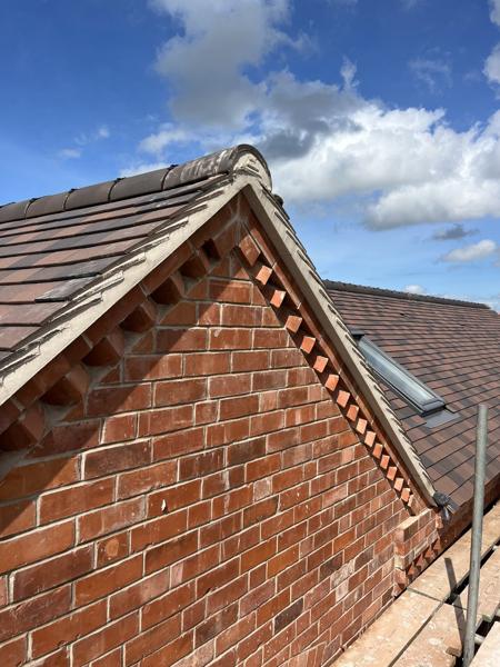 Decorative brick gable with new tiled roof – Staff4dshire Roofing Specialists