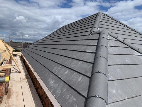 New hipped tile roof on a new build
