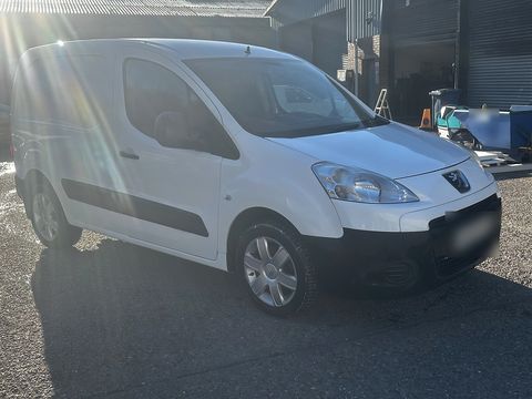 White Peugeot Partner van parked in a yard